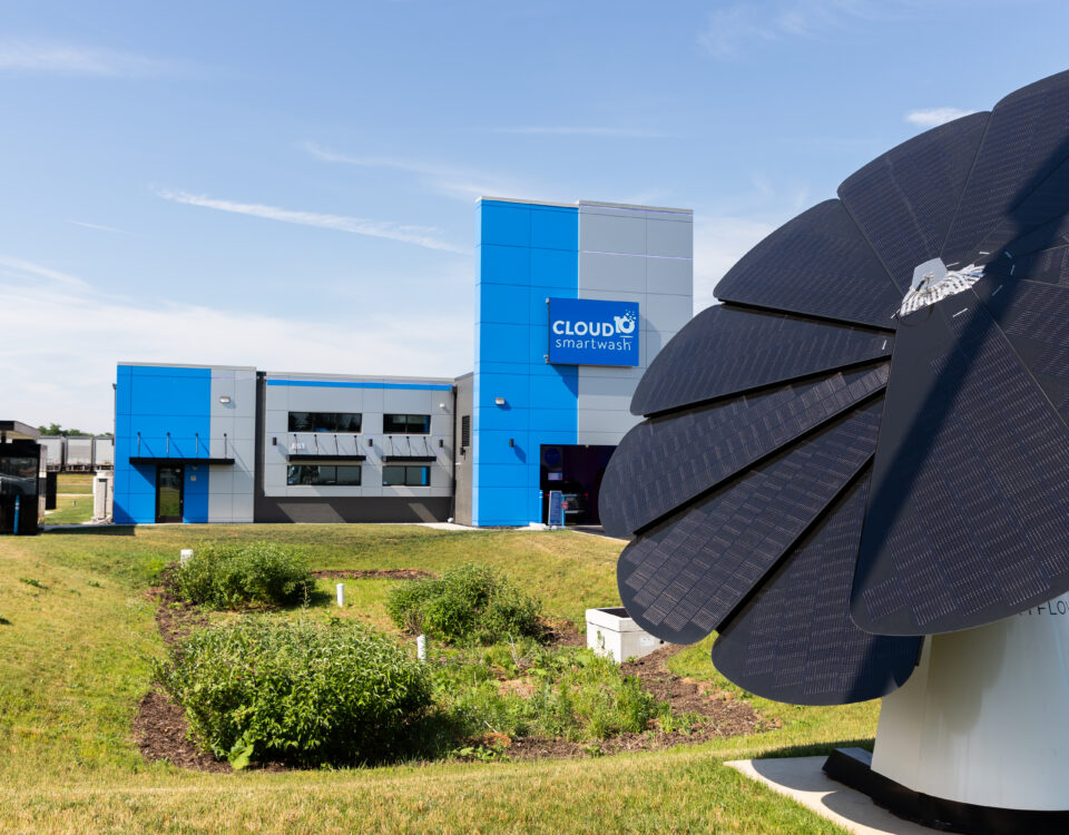 Cloud10 Smartwash behind a large, black solar panel structure