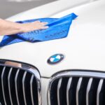 Man cleaning car with a Cloud10 smart car wash cloth