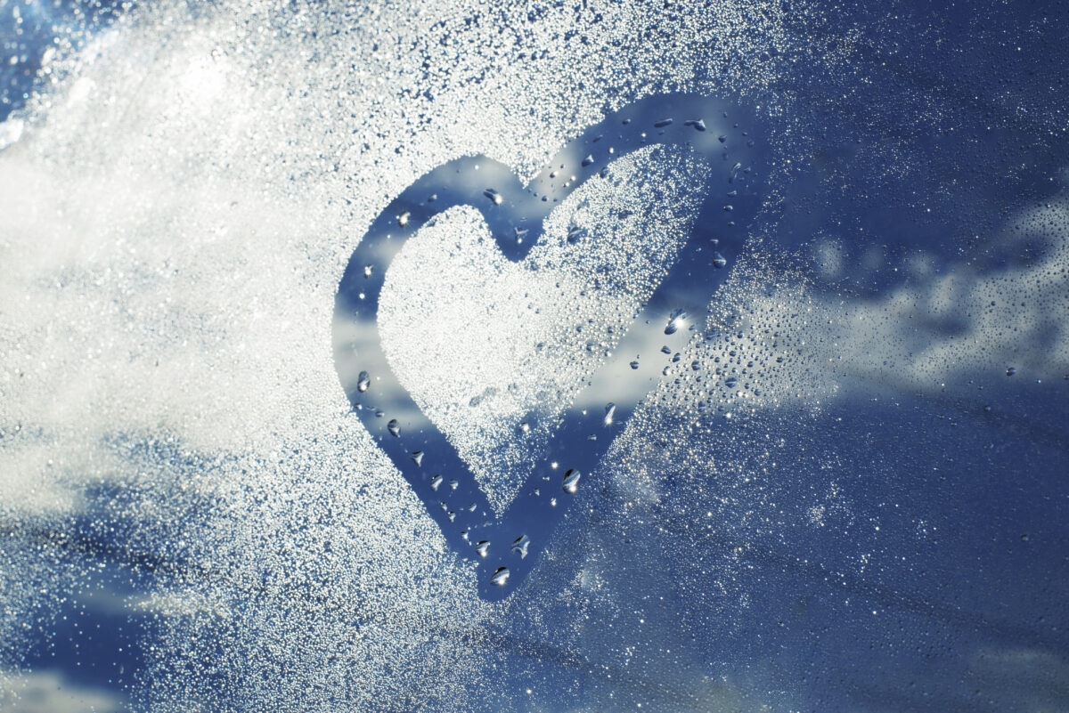 Heart drawn in humidity on a car window