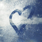 Heart drawn in humidity on a car window