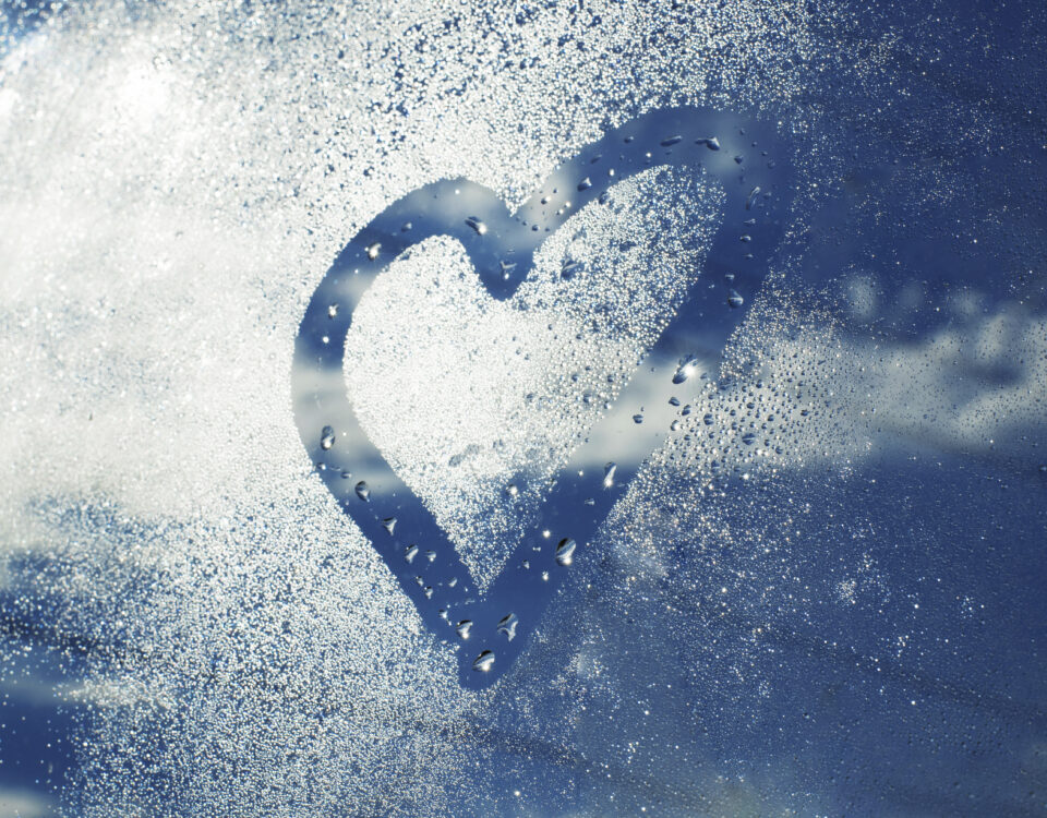 Heart drawn in humidity on a car window